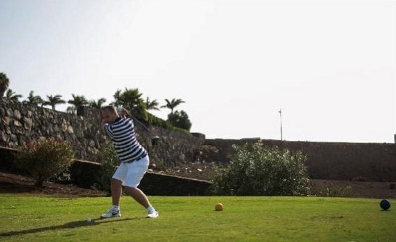 Dan playing golf